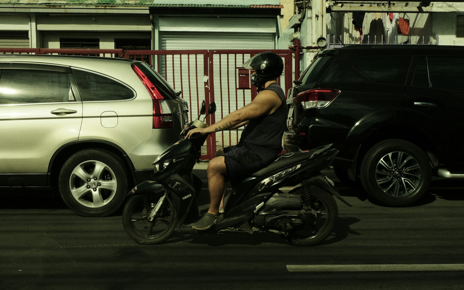 A motorcycle rider on a street in Quezon City, Metro Manila